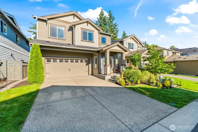 Stunning front exterior of 32540 Granite Ct, Black Diamond WA 98010 – modern craftsman-style home with a two-car garage, landscaped yard, and curb appeal in a sought-after neighborhood.