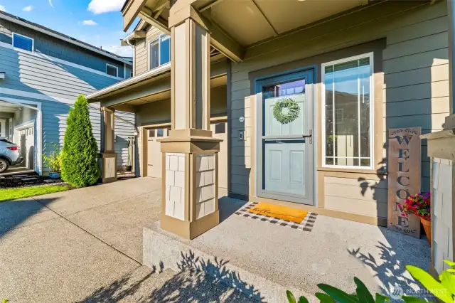 Inviting front entryway with covered porch, perfect for welcoming guests into this Black Diamond real estate gem.