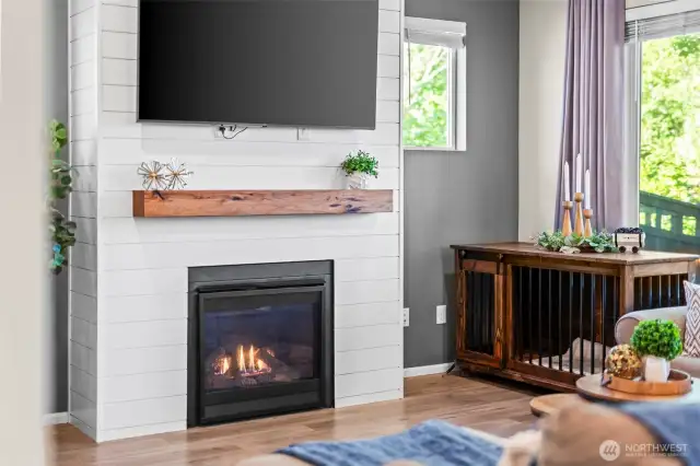 Living room focal point with gas fireplace and mounted TV space, creating the ultimate entertainment hub.