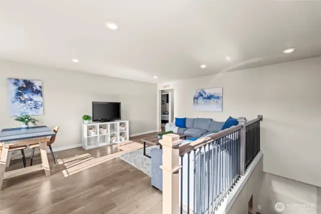 Spacious upstairs loft/bonus room with versatile living space, perfect for media, playroom, or home office in this Black Diamond home.