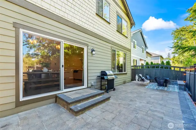 Backyard patio with sliding door access – perfect for BBQs and outdoor entertaining.