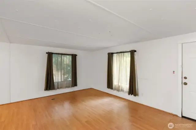 Double wide manufactured home offers 2 bedrooms, 2 full bathrooms, and plenty of elbow room.