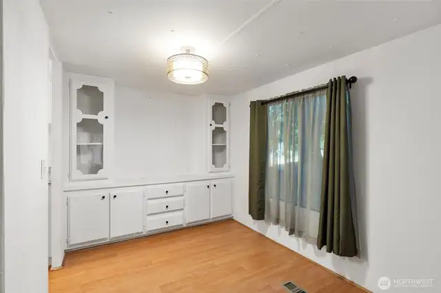Kitchen has plenty of counter space, and the adjacent dining room has a built in hutch.