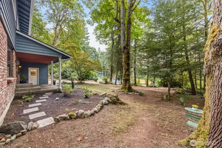 The picturesque front yard offers a wonderful blend of Pacific Northwest Native plants and colorful garden favorites!