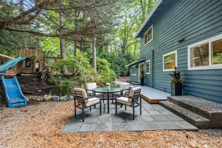 Perfect for play dates, entertaining for all ages, or just for easy afternoons at home, this extension of living spaces provides fresh air and a delightful backdrop of trees, birds, squirrels, and berries to eat!