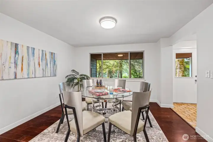 The formal dining room just inside the front door offers a large space that feels both separate and connected.