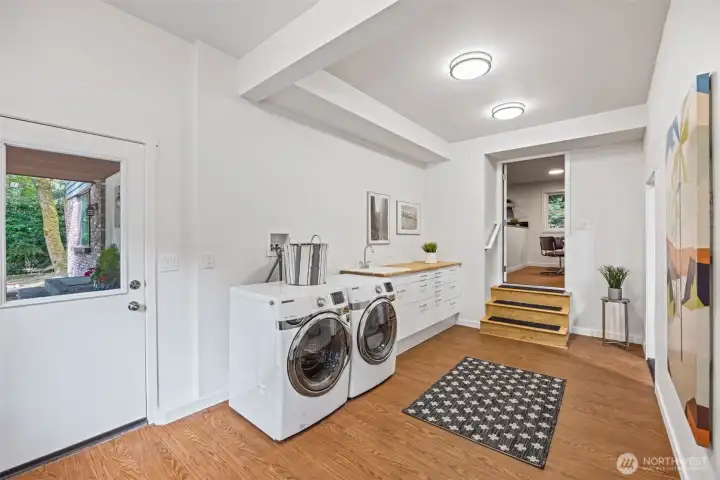 With its own exterior access to the front porch, access to the garage, and access to the family / kitchen area this is perfection of function.