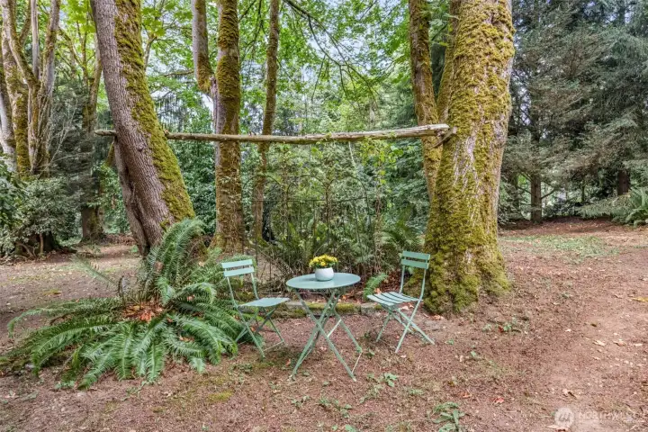 Just past the front of the house, this quiet reflection and relaxation area begs you to get outside more! Grab a book and a cup of tea and let the birds serenade you!