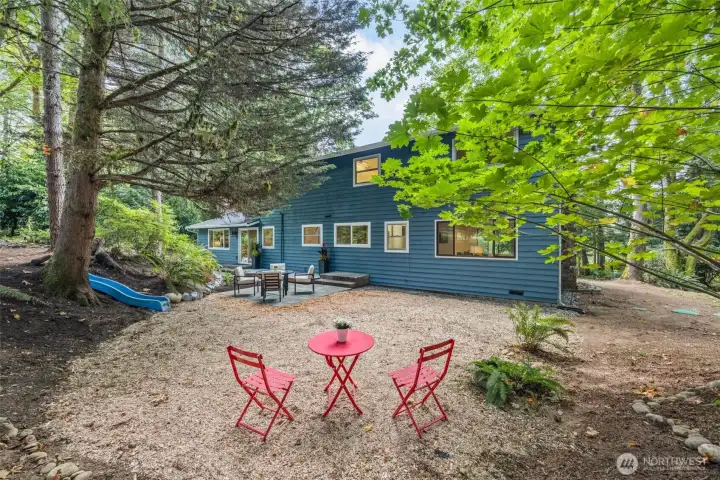 Beyond the back deck and patio, there's a large level area waiting for your vision and delight!