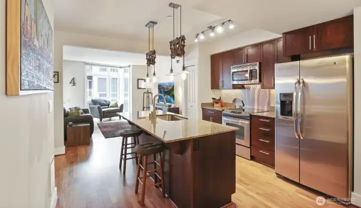 Center island kitchen with pantry and full size stainless steel appliances
