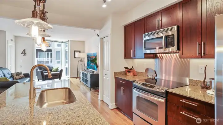 Center island kitchen with pantry and full size stainless steel appliances