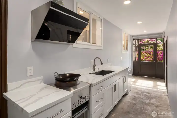 Additional artisan kitchen on main level.
