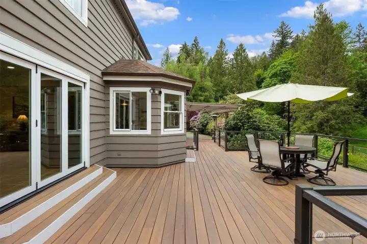 Expansive deck. Privacy by the year-round creek.
