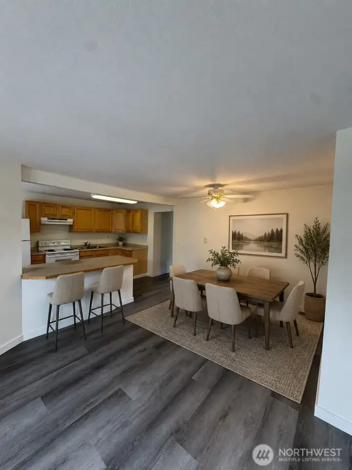 Dining area and eat-in kitchen counter, virtually staged Dining area and eat-in kitchen counter, virtually staged