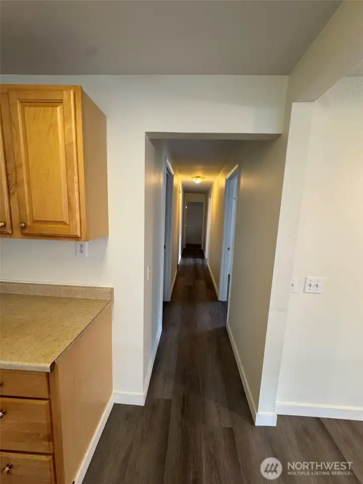 Hallway to Bedrooms 3 & 4, and the second full bathroom