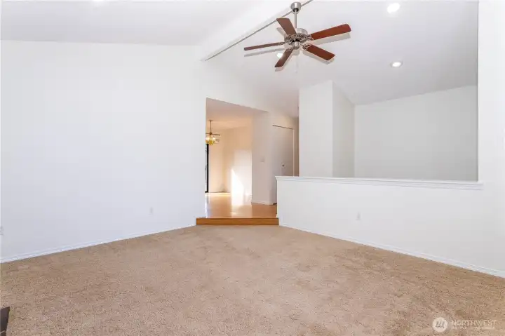 Dining area has slider to deck with stairs to lower level garden area