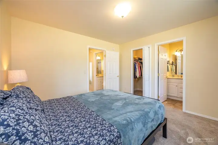 Primary bedroom with walk in closet and ensuite bathroom