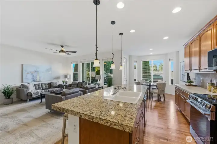 Island kitchen includes brand-new stainless-steel appliances. The informal dining area features a bump out that provides extra elbow room.