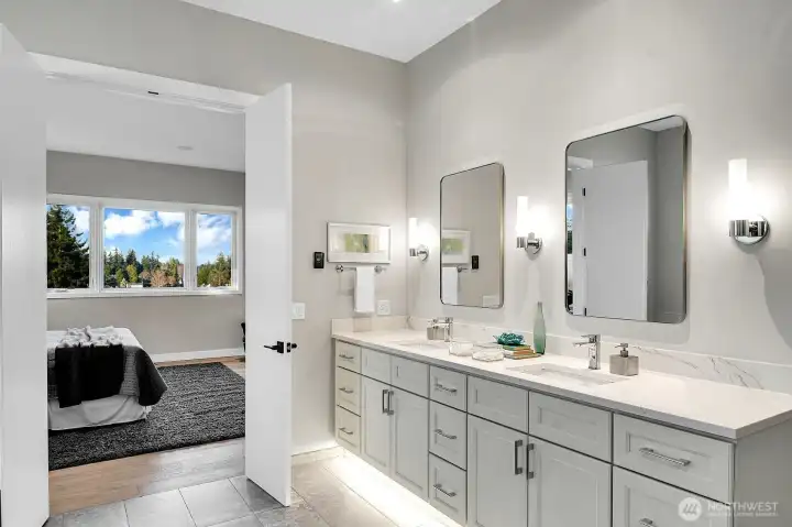 Quartz double sink vanity in main level primary.