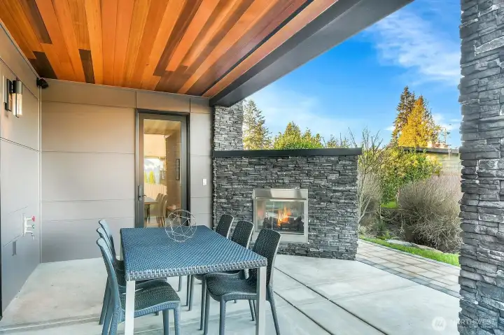 Entertain outdoors under waterproof Trex system, outdoor speakers, dual sided fireplace w/ hot tub hookups on the otherside!