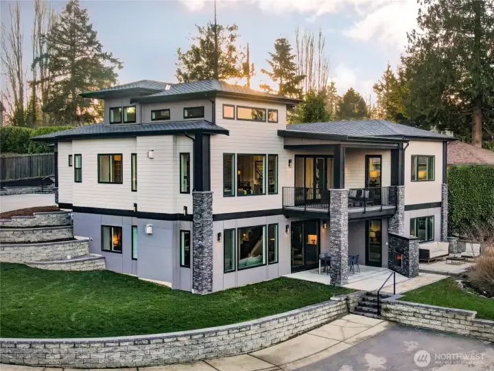 Hardy Siding, stacked stone details, 50 year presidential shingles, irrigation system, outdoor patio speakers in back, gutter system attached to short plat storm drainage system, clear cedar soffits, etc.