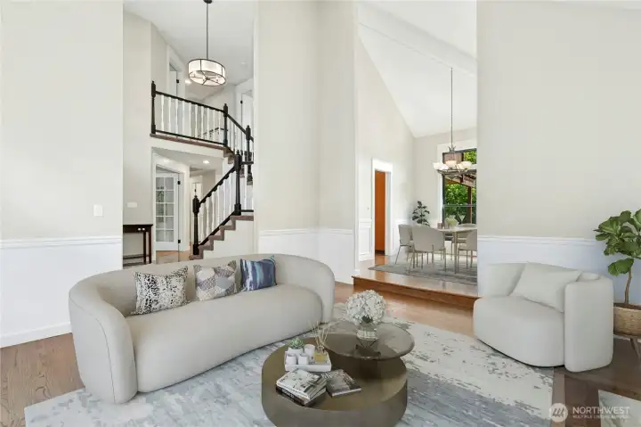 The living room and dining room flows together for easy entertaining or everyday use. Put a TV in this room and make another beautiful media space.