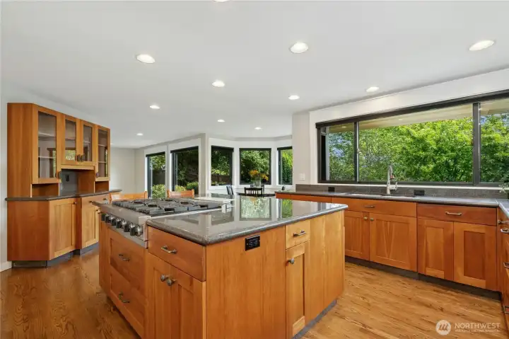 Solid wood cabinets in cherry. Slab granite and look at that huge island.