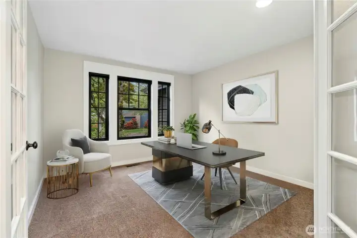 Here a main floor office or bedroom with a closet and French doors.