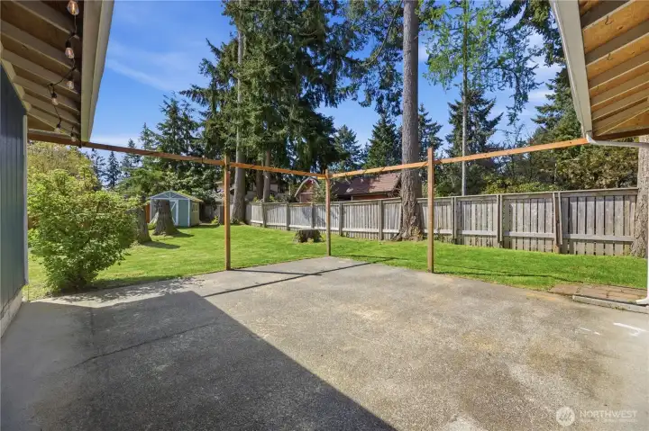 Large patio off the kitchen with SO much space and privacy