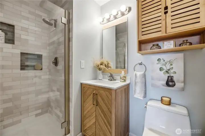 Primary bath with custom-tiled, walk-in shower
