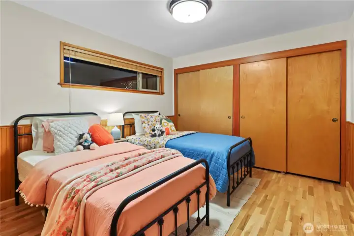 This room is spacious enough for two twins or a queen bed with two full-sized closets.