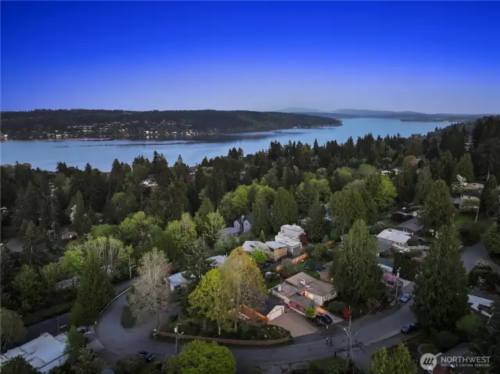 You can see the the light-colored garage where this home's paver driveway leads. Perched atop the pinnicle of the hill as the street rounds the corner. Close to Lake Washington and within the boundary to apply for an associate membership to Sheridan Beach Club. Waiting list is long, but well worth th3e way for a lifetime of memories.