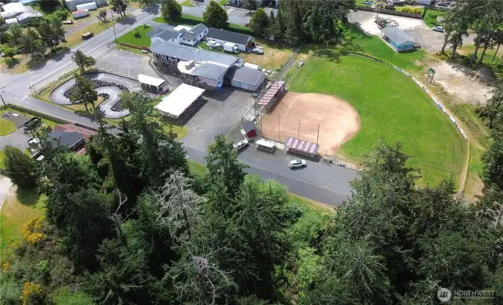 Across the street from the City Park and Ball Field.