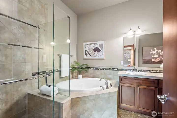 Elegance with ceramic tile throughout and glass shower with bench. Elegance with ceramic tile throughout and glass shower with bench.