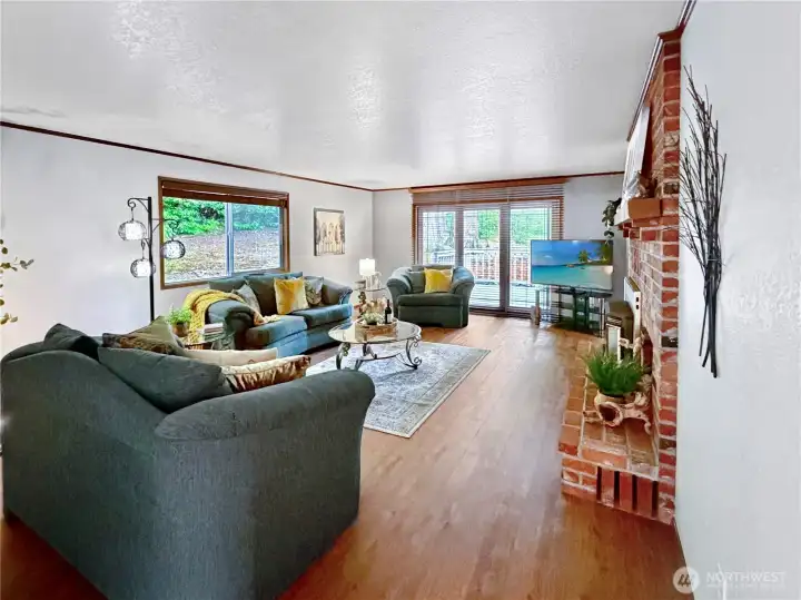 Generous living room with slider to deck.