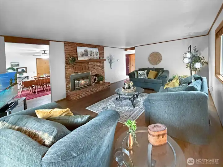 Another view of living room shows access to dining and kitchen to the left.