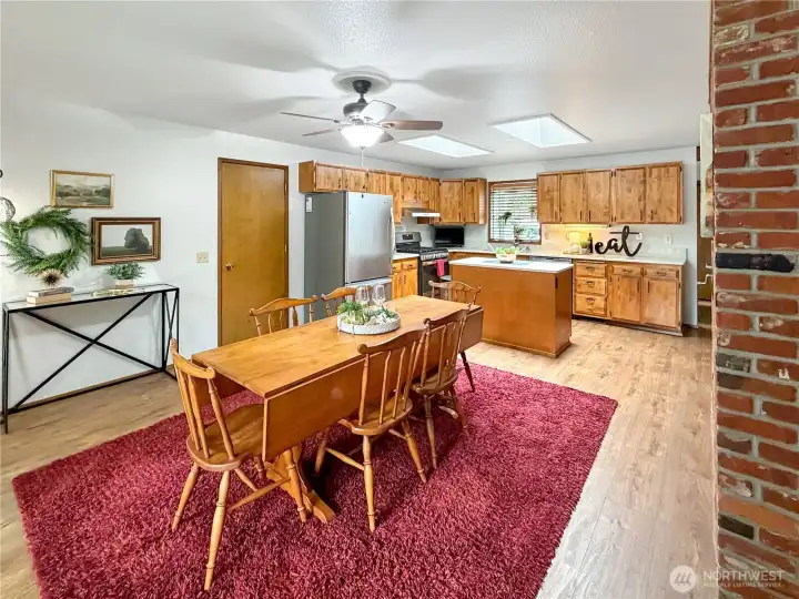 Large dining area just off kitchen is the perfect place to gather a crowd.