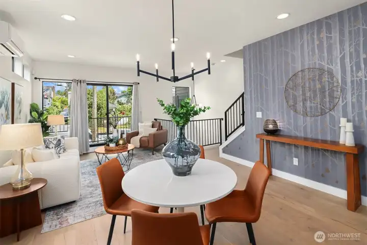 Spacious dining and living room with direct access to the covered deck overlooking the fully fenced front yard Spacious dining and living room with direct access to the covered deck overlooking the fully fenced front yard