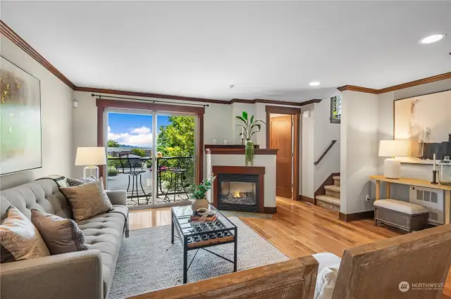 Charming living room with hardwood floors and a gas fireplace.