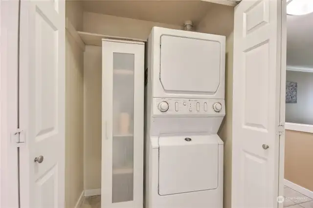 Laundry room with storage.