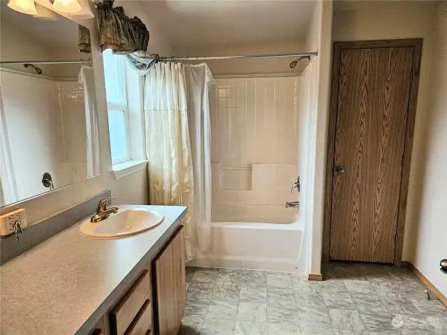 Primary bath with large vanity and spacious linen closet.