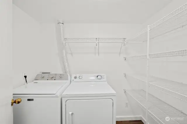 In unit laundry room with full size washer and dryer!  Lots of storage!