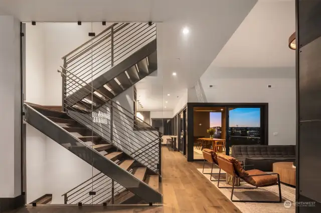 Main floor showing custom steel staircase with custom steel railings