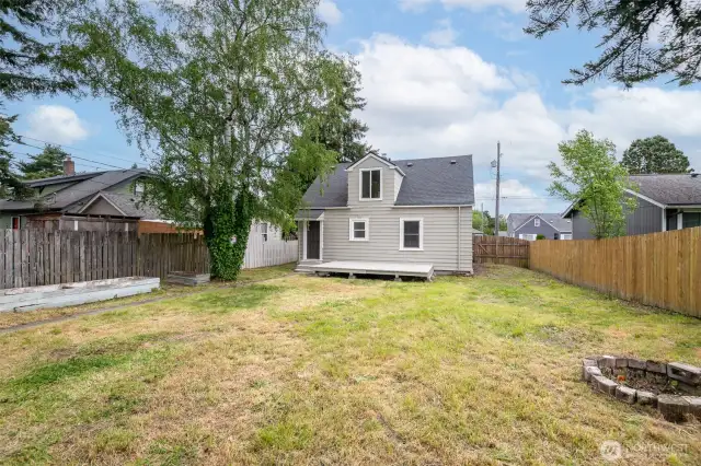 This spacious backyard provides plenty of room to play, relax, and garden.