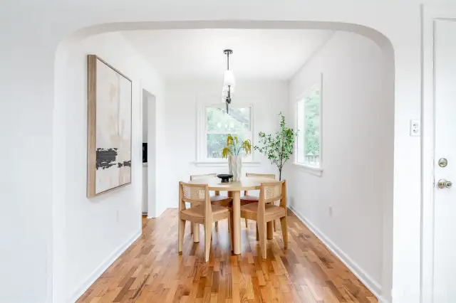 Updated light fixtures elevate this dining room, and other rooms in the house.