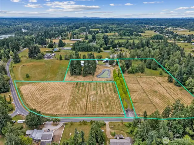 A private driveway with automatic gate leads you through scenic apple orchards to the heart of the estate.