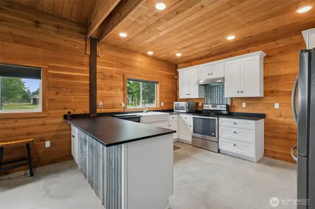Full Kitchen in clubhouse. The wood on the walls is from a tree milled from this property.