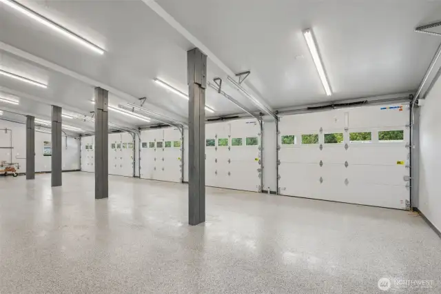 Featuring heated floors, 5 bays, a roll-up door, a car lift, and showroom-quality finishes—truly “Next Level.”