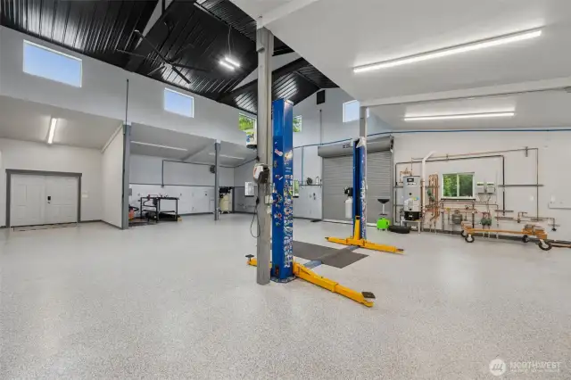 Featuring heated floors, 5 bays, a roll-up door, a car lift, and showroom-quality finishes—truly “Next Level.”