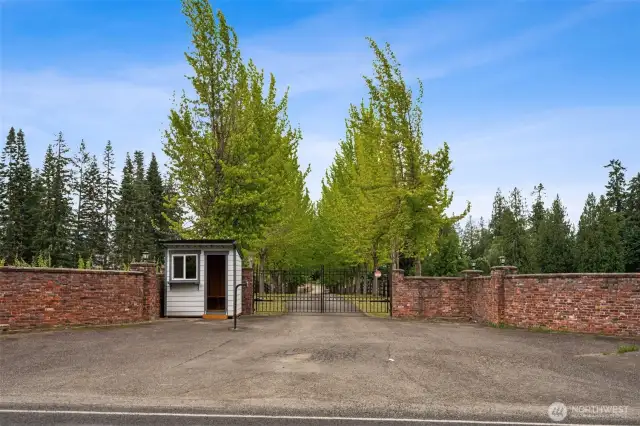 Private driveway with automatic gate leads you through scenic apple orchards to the heart of the estate.